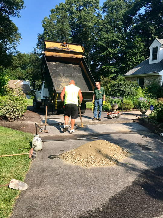our team fixing and replacing asphalt