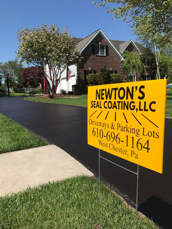 Picture of Newton's Sealcoating Sign posted on a driveway